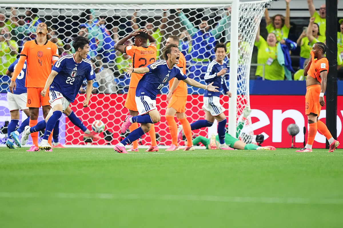 Japan's Koki Ogawa (19) and Takehiro Tomiyasu (22) celebrate their side's second goal against the Netherlands during a World Cup Group F soccer match in Arlington, Texas, near Dallas, Sunday, June 14, 2026. - AP Photo/Julio Cortez