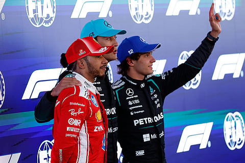 From left: Ferrari driver Lewis Hamilton of Britain, Mercedes driver George Russell of Britain, and Mercedes driver Andrea Kimi Antonelli of Italy celebrate after qualifying session for the Spain F1 Grand Prix at the Barcelona Catalunya racetrack in Montmelo, near Barcelona, Spain.