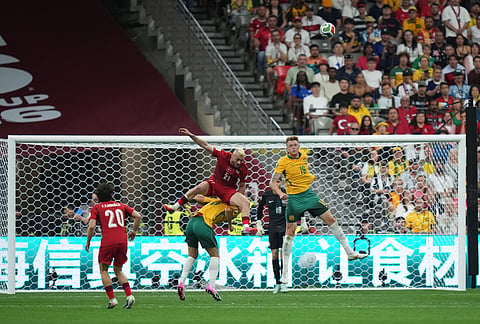 Australia's Harry Souttar (19) and Turkey's Barıs Alper Yılmaz (21) vie for the ball during the first half of a World Cup Group D soccer match in Vancouver, British Columbia, Saturday, June 13, 2026.