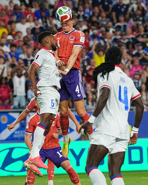 Haiti's Hannes Delcroix (5) and Scotland's Scott McTominay (4) compete to head the ball during the World Cup Group C soccer match between Haiti and Scotland in Foxborough, Mass., near Boston, Saturday, June 13, 2026.