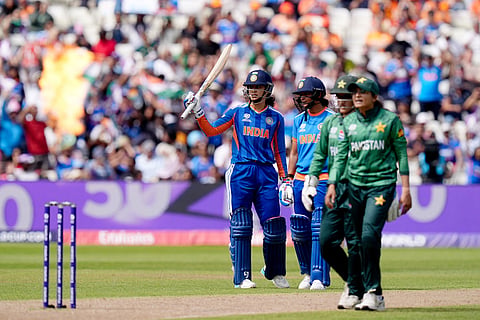 India's Smriti Mandhana hits her 50th run during the ICC Women's T20 World Cup, Group 1 cricket match between India and Pakistan in Birmingham, England.