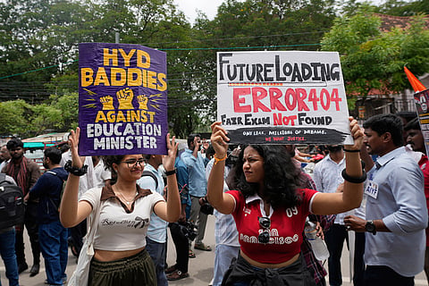 Supporters of the Cockroach Janta Party hold placards during a protest, part of the party's nationwide campaign, in Hyderabad, India.