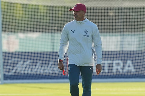 Portugal's head coach Roberto Martinez keeps and eye on the men's national soccer team training session ahead of their FIFA World Cup soccer tournament in Palm Beach Gardens, Fla.