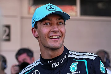 | Photo: AP/Fatima Shbair : Mercedes driver George Russell of Britain celebrates his pole position after qualifying session for the Spain F1 Grand Prix at the Barcelona Catalunya racetrack in Montmelo, near Barcelona, Spain.