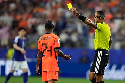 Netherlands' Crysencio Summerville receives a yellow card during the World Cup Group F soccer match between the Netherlands and Japan in Arlington, Texas, near Dallas, Sunday, June 14, 2026.