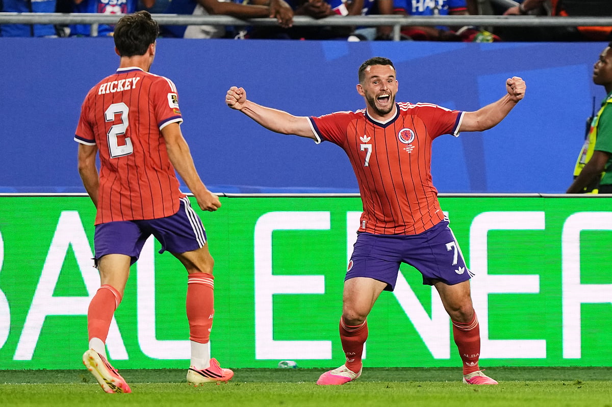 Scotland's John McGinn (7) celebrates with teammate Aaron Hickey (2) after scoring his team's first goal during the World Cup Group C soccer match between Haiti and Scotland in Foxborough, Mass., near Boston, Saturday, June 13, 2026. - AP Photo/Martin Meissner