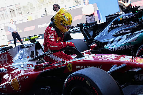 Ferrari driver Lewis Hamilton of Britain exits his car after qualifying session for the Spain F1 Grand Prix at the Barcelona Catalunya racetrack in Montmelo, near Barcelona, Spain.