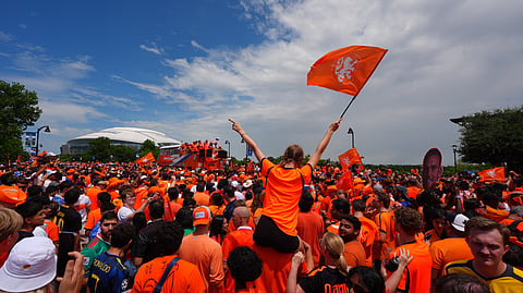 Fans conduct an "Orange Walk" to Dallas Stadium before the World Cup Group F soccer match between Japan and the Netherlands, Sunday, June 14, 2026, in Arlington, Texas.