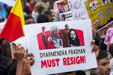 Students and others take part in a protest by CJP demanding the resignation of Union Education Minister Dharmendra Pradhan over the NEET paper leak and irregularities related to CBSE's on-screen marking system, at Freedom Park, in Bengaluru, Karnataka.