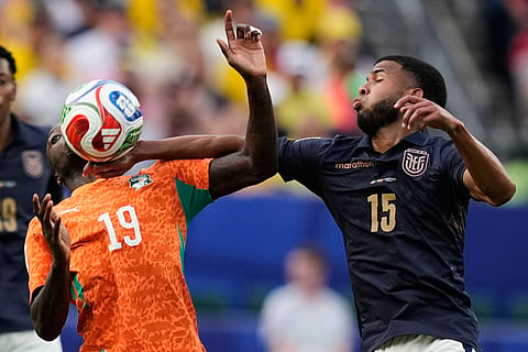 Ecuador's Pedro Vite, right, and Ivory Coast's Nicolas Pepe vie for the ball during a World Cup Group E soccer match in Philadelphia, Sunday, June 14, 2026.