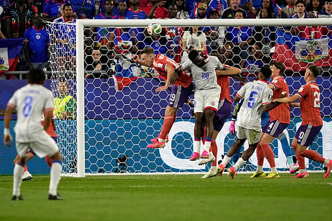 Scotland's Lewis Ferguson (19) and Haiti's Frantzdy Pierrot (20) go up for a header during the World Cup Group C soccer match between Haiti and Scotland in Foxborough, Mass., near Boston, Saturday, June 13, 2026.