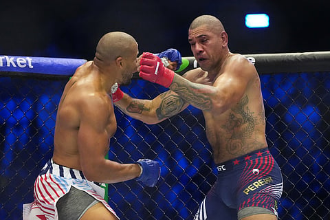 Alex Pereira, right, fights Ciryl Gane during their interim heavyweight title bout at UFC Freedom 250 on the South Lawn of the White House in Washington.