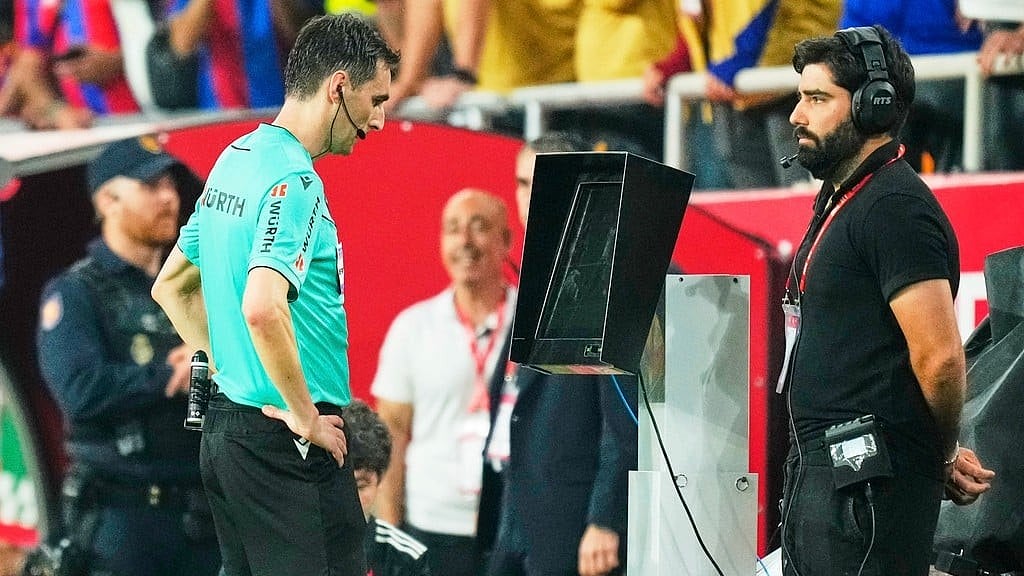 A match official reviews footage on the VAR monitor amid growing controversy surrounding allegations against a FIFA World Cup official. -  (AP Photo/Jose Breton, file)
