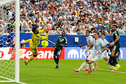 Saudi Arabia goalkeeper Mohammed Alowais makes a save during the World Cup Group H soccer match against Uruguay in Miami Gardens, Fla., Monday, June 15, 2026.