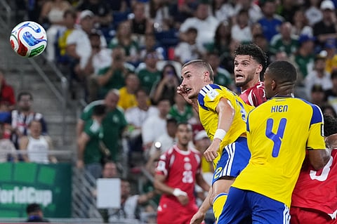 Tunisia's Omar Rekik, centre, heads the ball to score his team's first goal during the World Cup Group F soccer match between Sweden and Tunisia in Guadalupe, near Monterrey, Mexico, Sunday, June 14, 2026.