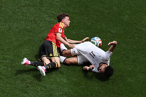 Belgium's Maxim De Cuyper (5) collides with Egypt's Mostafa Zico (11) during the World Cup Group G soccer match between Belgium and Egypt in Seattle, Monday, June 15, 2026.