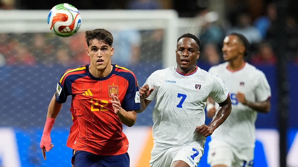 Spain's Pau Cubarsi (22) runs for the ball as Cape Verde's Jovane Cabral (7) follows him during the World Cup Group H soccer match between Spain and Cape Verde in Atlanta. - AP Photo