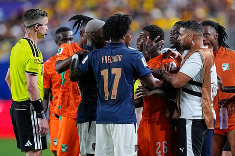Referee Francois Letexier watches as players react during the World Cup Group E soccer match between Ivory Coast and Ecuador in Philadelphia, Sunday, June 14, 2026.
