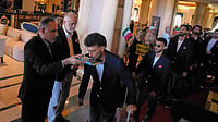 AP Photo/Khalil Hamra : Iran's FIFA World Cup 2026-bound players kiss the Quran as they leave for Antalya Airport in southern Turkey, Saturday, June 6, 2026. From there, the team will depart for Tijuana, Mexico.