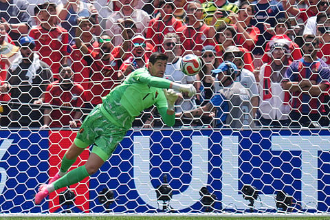 Belgium goalkeeper Thibaut Courtois punches a shot clear during the World Cup Group G soccer match between Belgium and Egypt in Seattle, Monday, June 15, 2026.