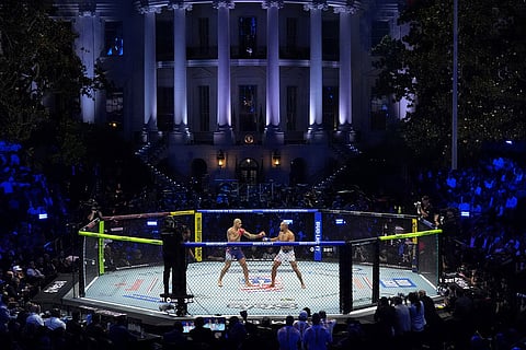 Alex Pereira, left, fights Ciryl Gane in a heavyweight title bout during UFC Freedom 250 on the South Lawn of the White House in Washington.