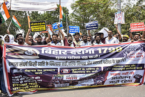 Aspirants stage a protest march demanding to cancel the Bihar Police Sub-Inspector examination due to alleged paper leak allegations, in Patna, Bihar.