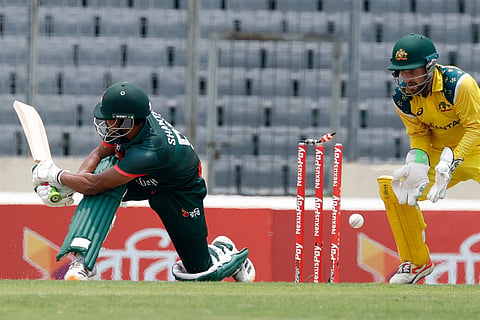 Bangladesh's Najmul Hossain Shanto bowled out by Australia's Matt Renshaw during the third one day international cricket match between Australia and Bangladesh, in Mirpur, Bangladesh.