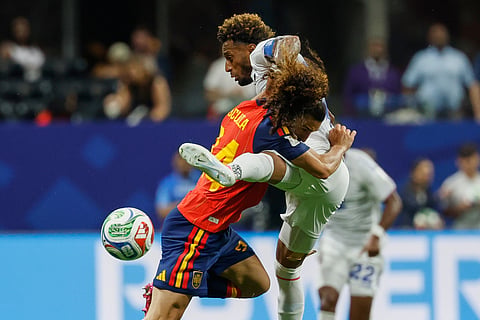 Spain's Marc Cucurella, left, and Cabo Verde's Ryan Mendes fight for the ball during the World Cup Group H soccer match between Spain and Cape Verde in Atlanta, Monday, June 15, 2026.