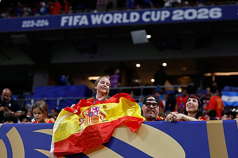 A girl holds Spanish flag before the World Cup Group H soccer match between Spain and Cape Verde in Atlanta.