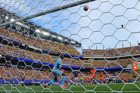 Ivory Coast goalkeeper Yahia Fofana (1) looks around as a shot from Ecuador's John Yeboah (9) hits the bar during the World Cup Group E soccer match between Ivory Coast and Ecuador in Philadelphia, Sunday, June 14, 2026.