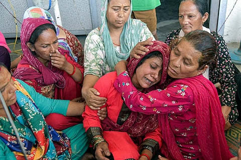 Family members and relatives mourn the death of Vinod Kumar, a 44-year-old local BJP functionary who was allegedly beaten to death, while three members of his family were injured when a group of people allegedly attacked their home over an irrigation dispute, in Bairagiwala village, Dehradun.