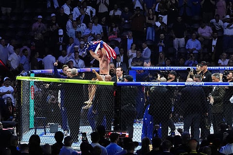 Justin Gaethje celebrates after defeating Ilia Topuria in a lightweight title bout during UFC Freedom 250 on the South Lawn of the White House in Washington.
