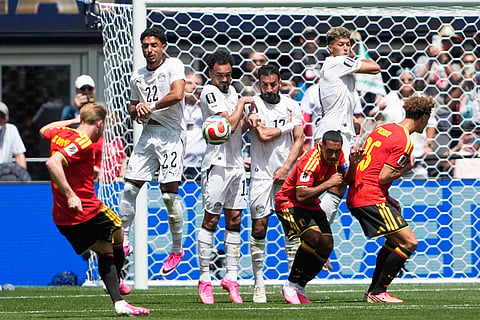 Belgium's Kevin De Bruyne, left, kicks a free kick against Egypt during the World Cup Group G soccer match in Seattle, Monday, June 15, 2026.