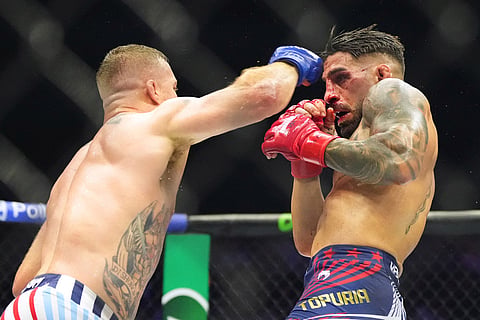 Ilia Toupruia, right, fights Justin Gaethje during UFC Freedom 250 on the South Lawn of the White House in Washington.