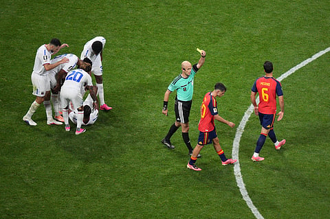 Spain's Pedri (20) draws a yellow card after a foul against Cape Verde's Nuno da Costa (21) during the World Cup Group H soccer match between Spain and Cape Verde in Atlanta, Monday, June 15, 2026.