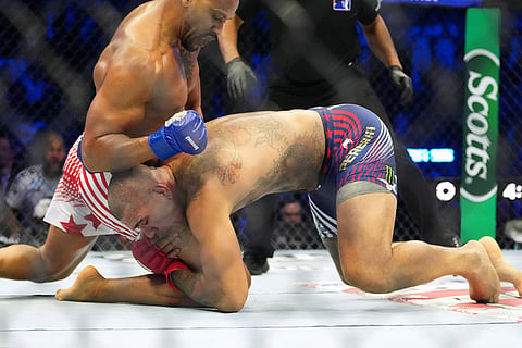 Alex Pereira, bottom, fights Ciryl Gane during their interim heavyweight title bout at UFC Freedom 250 on the South Lawn of the White House in Washington.