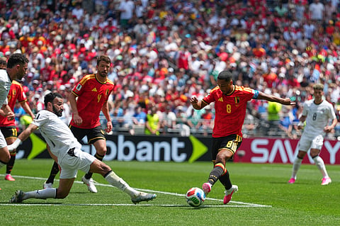Belgium's Youri Tielemans, right, attempts a shot on goal during the World Cup Group G soccer match between Belgium and Egypt in Seattle, Monday, June 15, 2026.