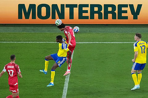 Tunisia's Omar Rekik, center, heads the ball against Sweden's Alexander Isak during the World Cup Group F soccer match between Sweden and Tunisia in Guadalupe, near Monterrey, Mexico, Sunday, June 14, 2026.
