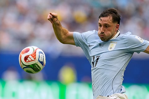 Uruguay's Matias Vina views the ball during a World Cup Group H soccer match against Saudi Arabia in Miami Gardens, Fla., Monday, June 15, 2026.