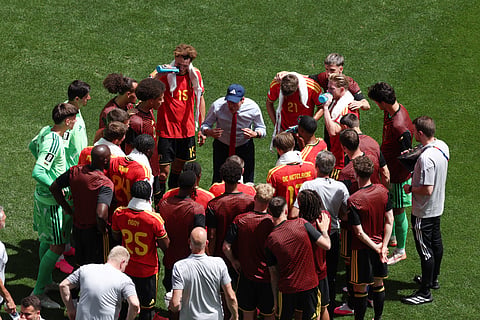 Belgium head coach Rudi Garcia talks to the team during a hydration break during the World Cup Group G soccer match between Belgium and Egypt in Seattle, Monday, June 15, 2026.
