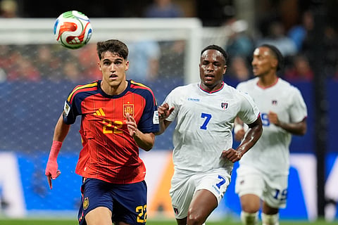 Spain's Pau Cubarsi (22) runs for the ball as Cape Verde's Jovane Cabral (7) follows him during the World Cup Group H soccer match between Spain and Cape Verde in Atlanta, Monday, June 15, 2026.