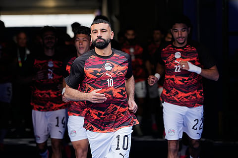Egypt's Mohamed Salah, front, enters to the the field for the warm-up ahead of the World Cup Group G soccer match against Belgium, in Seattle 