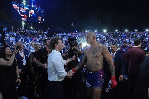 Alex Pereira greets Meta CEO Mark Zuckerberg after his interim heavyweight title bout loss to Ciryl Gane at UFC Freedom 250 on the South Lawn of the White House in Washington.