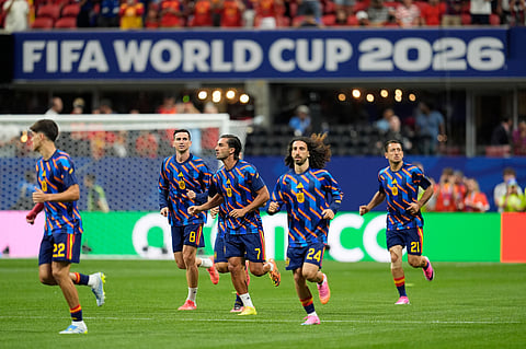 Spain players warm up before the start of the World Cup Group H soccer match between Spain and Cape Verde in Atlanta.
