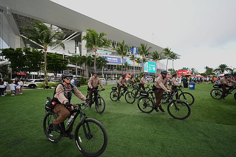 Police officers ride bicycles outside the stadium prior to the World Cup Group H soccer match between Saudi Arabia and Uruguay in Miami Gardens, Fla., Monday, June 15, 2026.