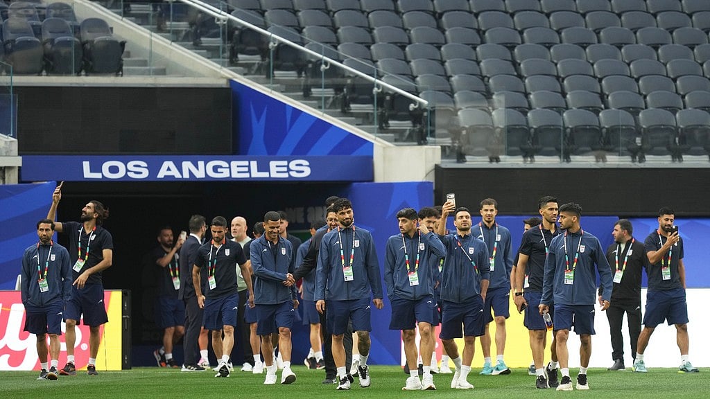 Iran players walk onto the pitch at the stadium one day before their FIFA World Cup match against New Zealand in Inglewood, Calif., near Los Angeles. - AP Photo