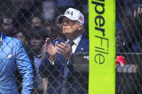 President Donald Trump applauds after Justin Gaethje defeated Ilia Toupruia in the lightweight championship bout at UFC Freedom 250 on the South Lawn of the White House in Washington.