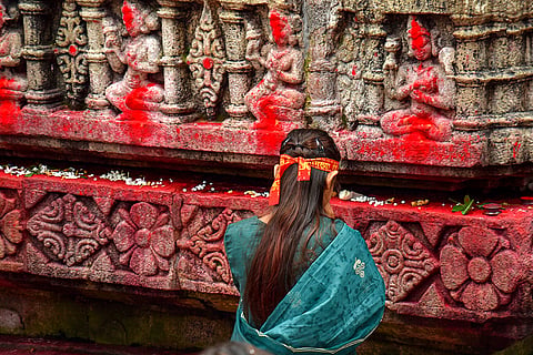 A woman offers prayers at the Kamakhya Temple ahead of the 'Ambubachi Mela', in Guwahati, Assam,