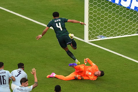 Saudi Arabia's Abdulelah Alamri (4) celebrates scoring their opening goal against Uruguay goalkeeper Fernando Muslera (23) during the World Cup Group H soccer match between Saudi Arabia and Uruguay in Miami Gardens, Fla., Monday, June 15, 2026.