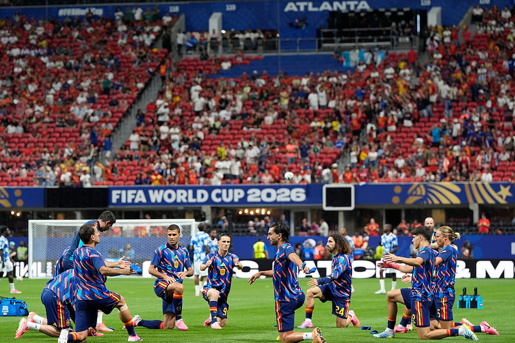 Spain players warm up before the start of the World Cup Group H soccer match between Spain and Cape Verde in Atlanta. - AP Photo